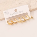 Three pairs of golden stainless steel hoop earrings in different sizes on a display card - 7# Square