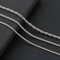 Three sleek silver twist chain necklaces in various thicknesses on black background - 3mm 45cm / Steel