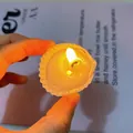 Handmade white shell-shaped scented candle with flickering flame on magazine background - Small Lion Shell Candle [Approx. 4cm] / Freesia [Bagged]