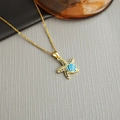Elegant gold starfish necklace with blue crystals and shell detail on a textured background - Starfish Shell-Gold 0374J