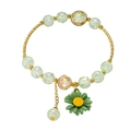 Sweet light green crackle bead bracelet with gold accents and a dark green daisy charm - Metal Half Ring Daisy Style / Green