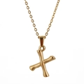 Golden stainless steel necklace featuring a textured 3D bamboo style letter X pendant - Letter X