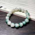 Macro shot of cat paw shaped beads bracelet with translucent green and white gradient finish - Floating Flower Green Cat Paw
