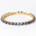 Golden tennis bracelet featuring 6mm round-cut blue cubic zirconia stones with a secure clasp - Blue Zircon Gold