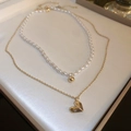 Detail of double-layer necklace with white pearls, gold heart pendant, and beads - Gold Heart Pearl Necklace (2-Piece Set)