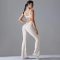 Detail showing backless cut and scrunch butt lifting design on cream yoga jumpsuit - S / Off-White Grey