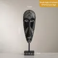 Small African tribal mask ornament with white geometric patterns on a black resin base - Small Mask Ornament / 10x6x33.5cm