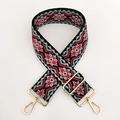 Close-up of ethnic jacquard embroidery pattern and gold metal buckles on bag strap - Blue Green Red Floral