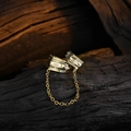 Elegant gold chain earrings with star engravings and zircon stones on charred wood background - Copper / Gold