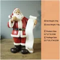 Resin Santa Claus ornament holding a white scroll with dimensions and net weight details - Santa Writing List