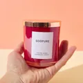 Handmade red glass scented candle jar with a rose gold metal lid held by a hand - No Lid / Red
