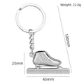 Porte-clés patins à glace en métal argenté pour sport d'hiver avec dimensions - Patin de Vitesse (Argent)
