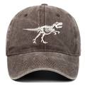 Detailed close-up of white dinosaur skeleton embroidery on washed dark grey cotton baseball cap - One Size / Coffee
