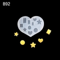 Mini heart silicone mold for DIY cookies and wax melts on a black background - B92