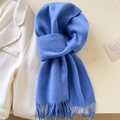 Soft blue wool-like scarf with fringe tassels paired with a white winter coat - Sky Blue