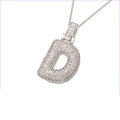 Macro view of iced out silver letter D pendant with cubic zirconia on box chain - Silver D