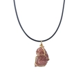 Detail of pink natural crystal pendant with gold wire wrap on a black cord necklace - Strawberry Quartz