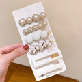 Elegant pearl and rhinestone hair clip set in gold and white finish on a card - Camellia 6-piece Set