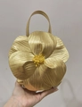 Golden flower petal tote bag featuring detailed yellow stamen and metallic leather finish - Gold