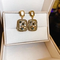 Detailed macro view of gold rectangular earrings with multicolor crystals and stones - 7# Silver Earring Post - Gold Rectangular Multi-Color Rhinestone (WE1177)