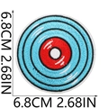 Close-up of 6.8cm round record-style embroidered patch with blue and red thread details - No. 27 (Concentric Circles Record)