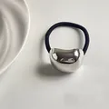 Minimalist elastic hair tie featuring a polished silver bean metal ornament in black - Silver Small Bean