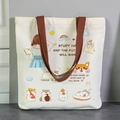 Cream canvas tote bag with cute cartoon illustrations and dark brown handles - Effort for Future-EN