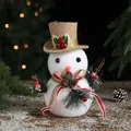 White flocked foam snowman decoration with brown hat and pine cones 19cm height - 19x15cm