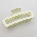 Close-up of matte beige rectangular hair claw clip with strong teeth on fabric - Large (13CM) / Ivory