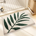 Plush beige bath mat with dark green leaf pattern and non-slip absorbent flocking - Bamboo Forest