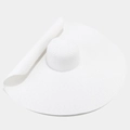 Detail of white wide-brim straw hat featuring fine woven texture and flexible wavy edge - White