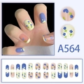 Detail view of A564 press-on nails featuring blue tulips, dots and mixed color designs - Blue Yellow Tulip (A564)