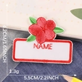 Embroidered name patch with red flower and NAME text for kids clothing and bags - Red Flower