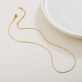 Elegant gold titanium snake bone chain necklace with adjustable lobster clasp closure - Hammered Round Chain