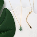 Elegant K18 gold necklace featuring a deep green agate gourd pendant on a shell tray - Green Aventurine