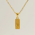 Elegant gold square pendant necklace featuring polished initial letter N on matte finish - Letter N