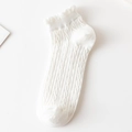 White crew socks featuring cable knit patterns and ruffled lettuce trim cuffs - No-Show Socks / White
