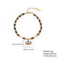 Bracciale boho con ciondolo malocchio, perline cilindriche marroni e dettagli dorati - Marrone/Ciondolo Ciglia