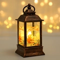 Bronze Christmas lantern with Santa graphics and warm LED light in a festive glow - Santa Claus / Bronze