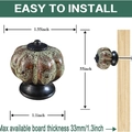 Vintage pumpkin ceramic cabinet knob with green speckled glaze and black base - Leopard Green
