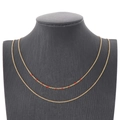 Collier double rang en acier inoxydable doré orné de délicates perles rouges fines - Rouge