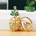 Detail of pineapple keychain with colorful opal stones and golden lobster clasp - Single OPP Bag Packaging / Colorful Cat Eye Pineapple