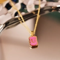 Gold plated stainless steel necklace featuring a pink glitter pendant with letter U - Letter U