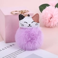 Detail of light purple faux rabbit fur cat keychain with golden metal hardware - Purple