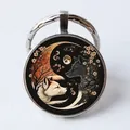 Round alloy keychain with glass dome featuring wolf yin yang tai chi artistic design - Yin Yang Wolves/Moon Blossom