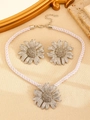 Silver bohemian daisy jewelry set with necklace and stud earrings on textured background - Silver Daisy Jewelry Set (9564+4867)