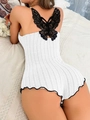 Body bianco a costine con grande pizzo nero a farfalla sul retro e orli a onde - S / Bianco