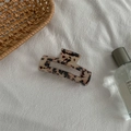 Macro detail of tortoiseshell acetate hair claw clip on white textured linen fabric - Medium Square Claw / Light Tortoiseshell