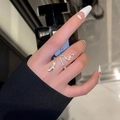 Silver snake wrap ring with white pavé crystals and an adjustable open design - Snake Ring