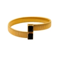 Detail of gold flexible woven mesh bracelet featuring two square black stone accents - Black